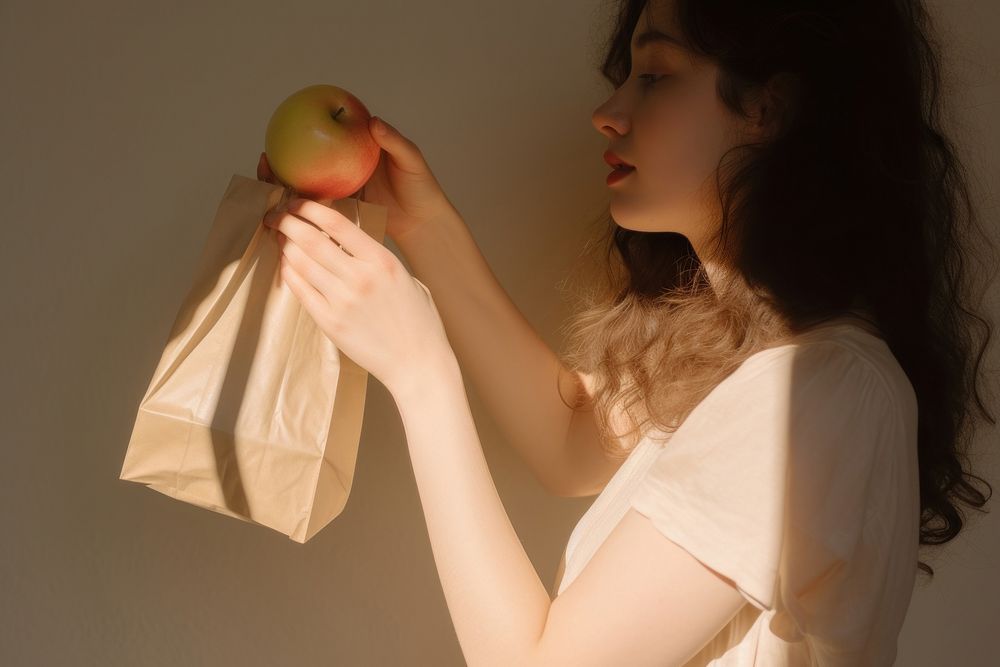 Hand holding fruits paper bag adult apple food. AI generated Image by rawpixel.