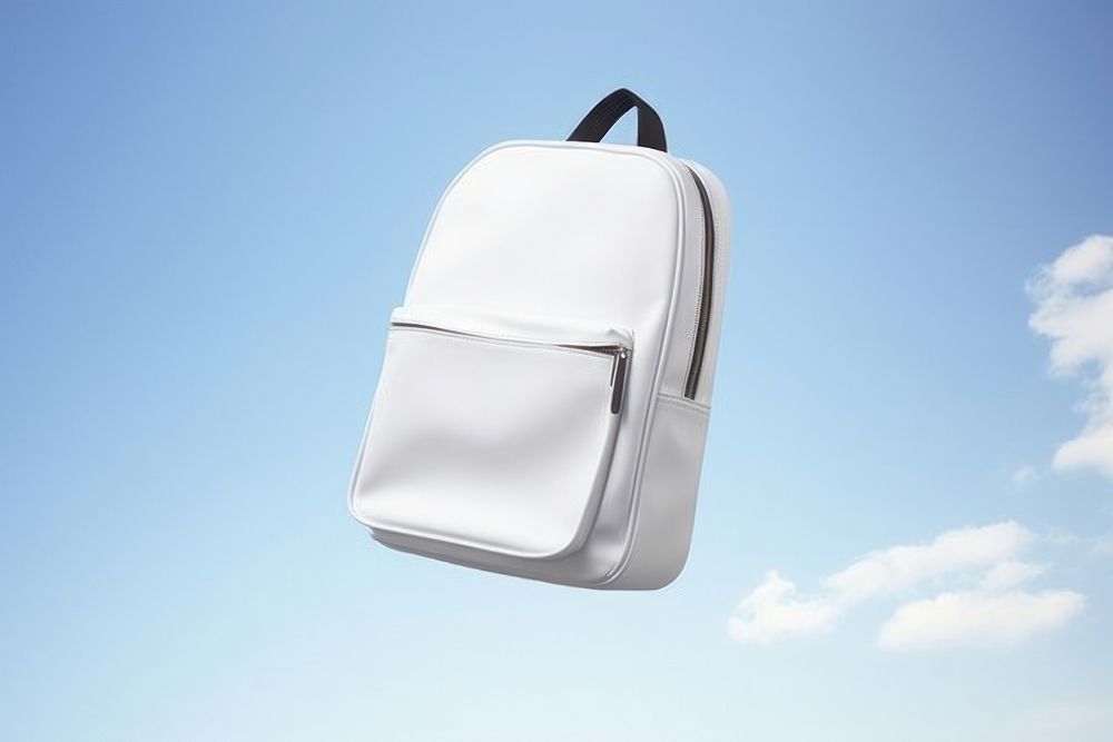 School bag floating in the air backpack handbag accessories. AI generated Image by rawpixel.