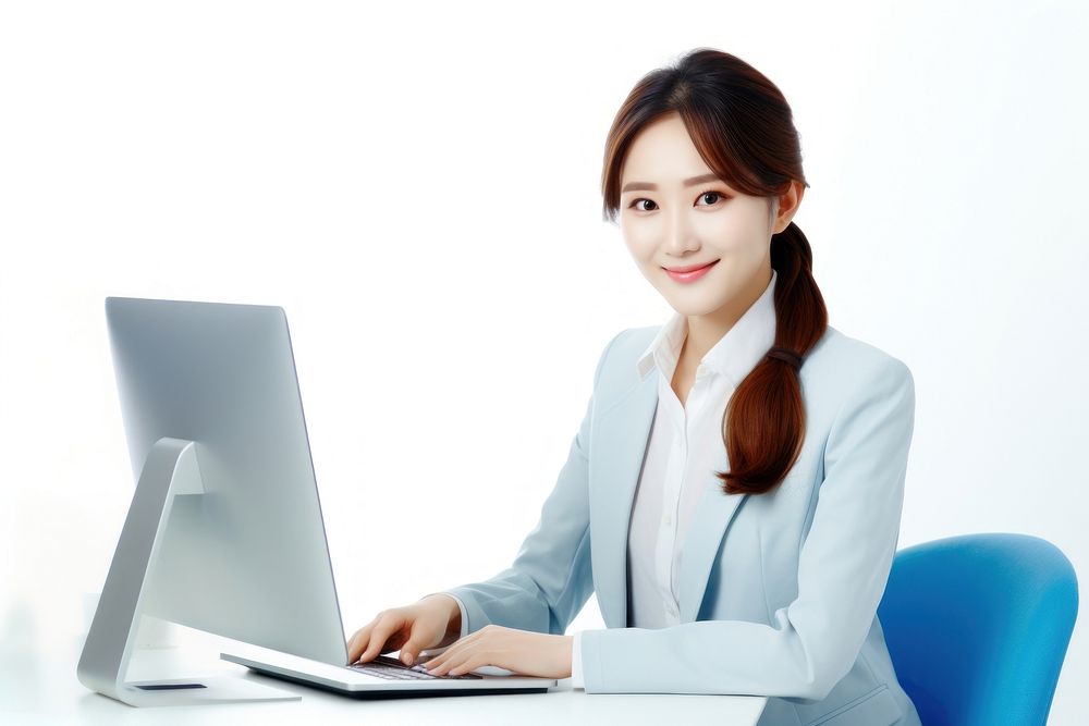 A Portrait of Beautiful Asian Manager Using Desktop Computer computer sitting laptop. AI generated Image by rawpixel.