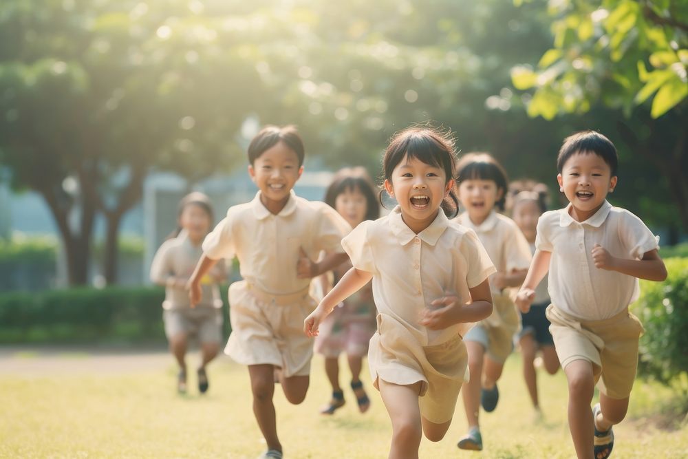 Group of asian children running in the park happy cute togetherness. AI generated Image by rawpixel.