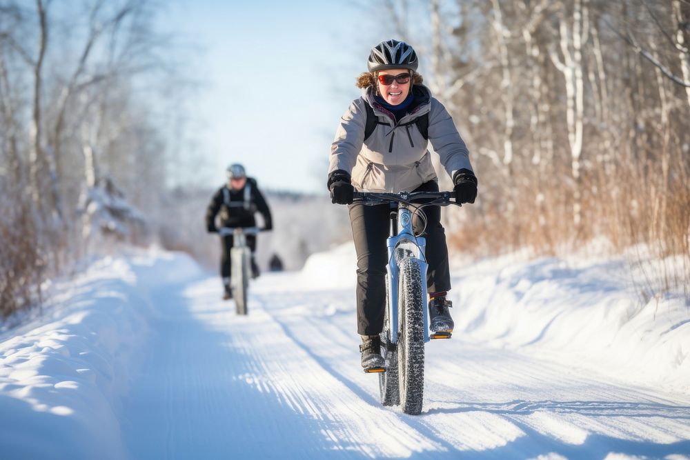 Mature woman riding bike on ice trail cycling bicycle vehicle. AI generated Image by rawpixel.