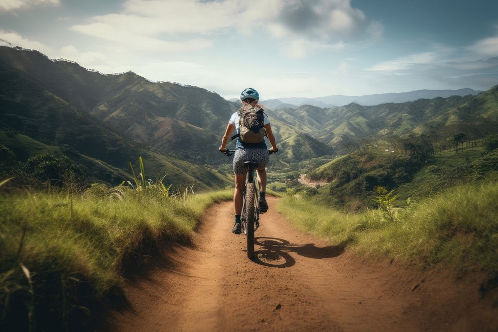 Mature woman riding bike on mountain trail cycling bicycle vehicle. AI generated Image by rawpixel.