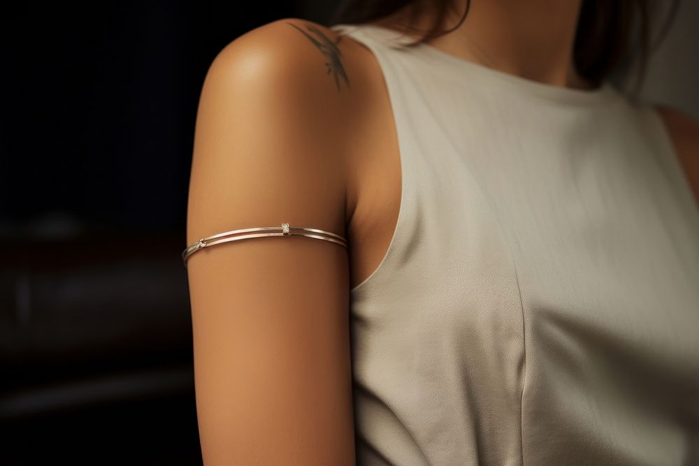 Armlace jewelry on woman arm skin midsection hairstyle. AI generated Image by rawpixel.