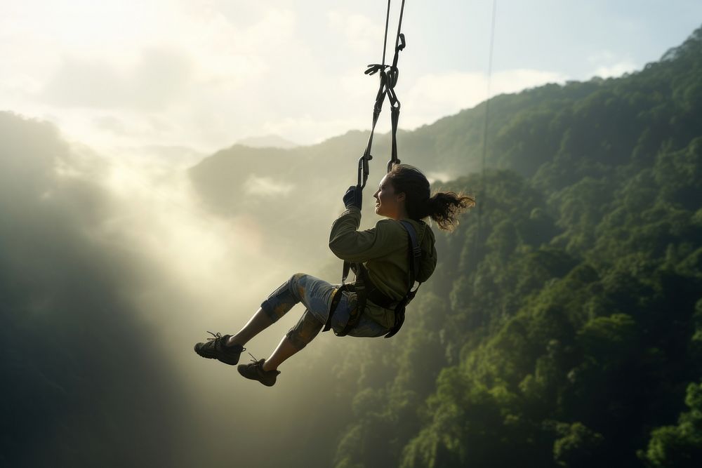 Mature woman on zipline adventure recreation outdoors. AI generated Image by rawpixel.