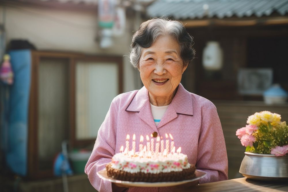 Elder korean woman cake birthday dessert. AI generated Image by rawpixel.