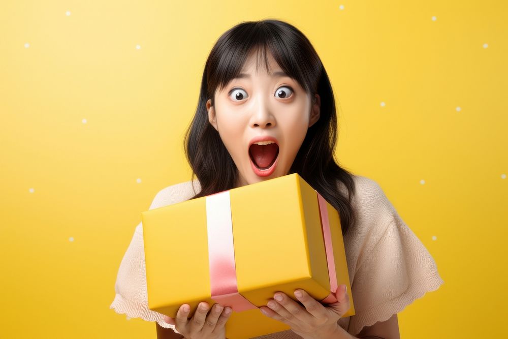 Japanese young girl surprised birthday box. AI generated Image by rawpixel.