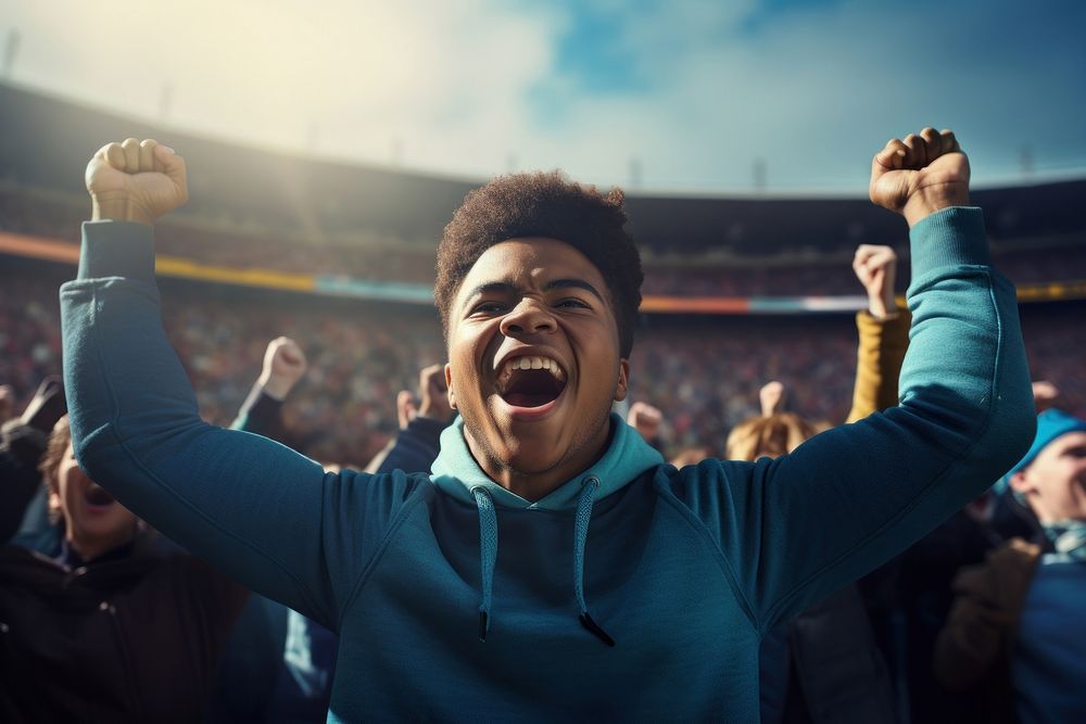 Black teen male cheering football game in stadium shouting sports adult. 