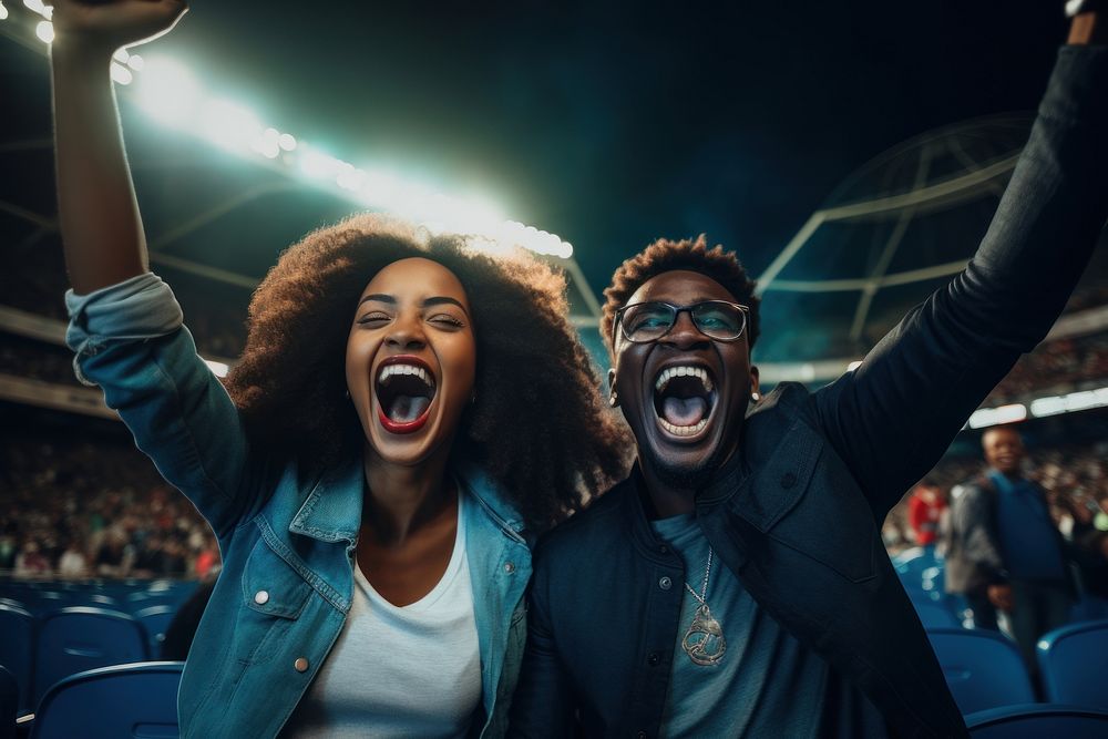 Black couple cheering sport game shouting laughing stadium. AI generated Image by rawpixel.