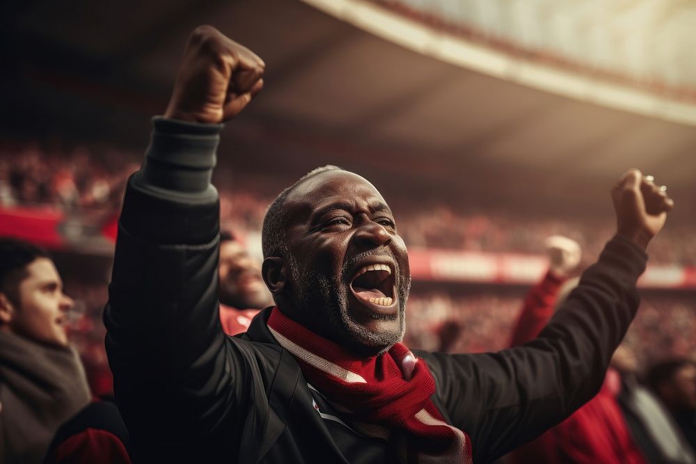 Black mature man cheering football game in stadium shouting sports adult. AI generated Image by rawpixel.