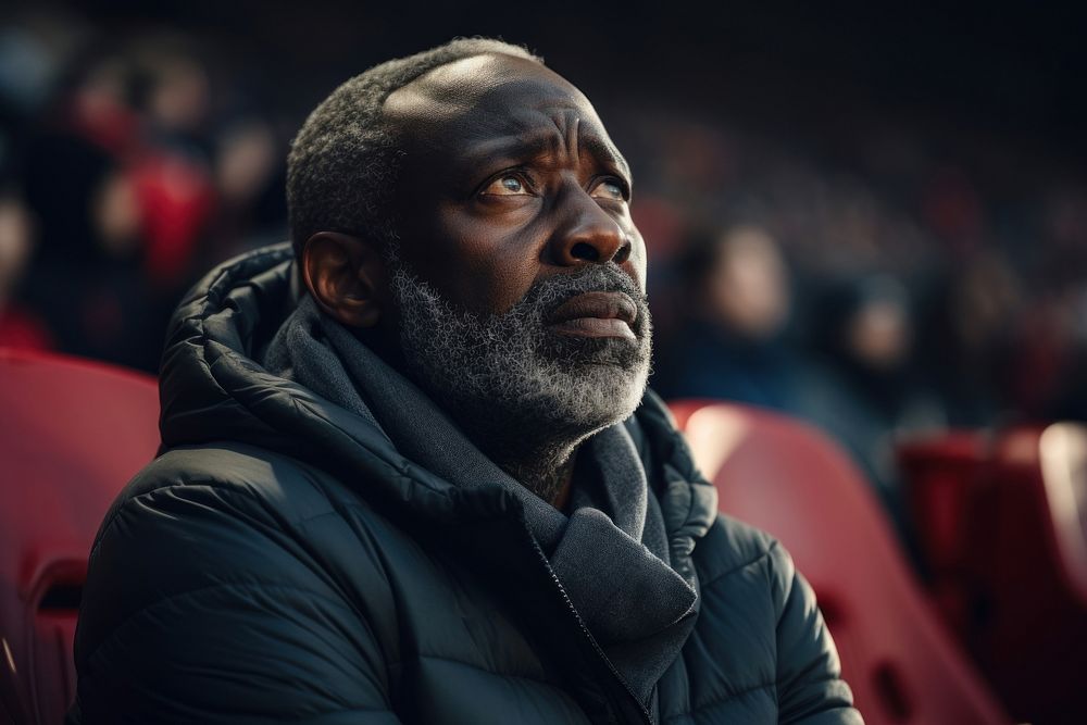 Black mature man sad at football game in stadium portrait sports adult. AI generated Image by rawpixel.