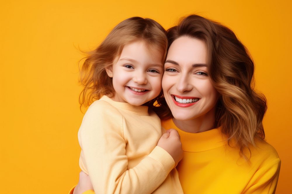 Cheerful lovely daughter and mother hugging laughing family child. AI generated Image by rawpixel.