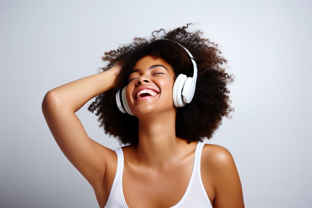 African american woman delight headphones laughing headset. AI generated Image by rawpixel.