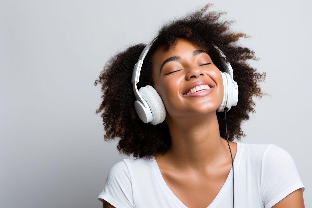 African american woman delight headphones headset smile. AI generated Image by rawpixel.