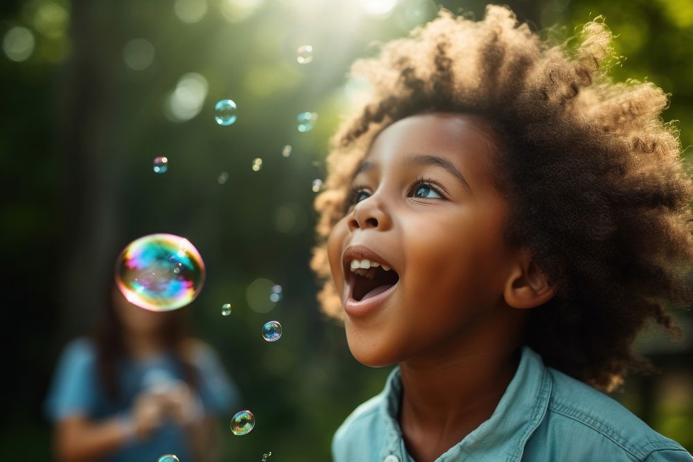 Bubble child laughing blowing. AI generated Image by rawpixel.