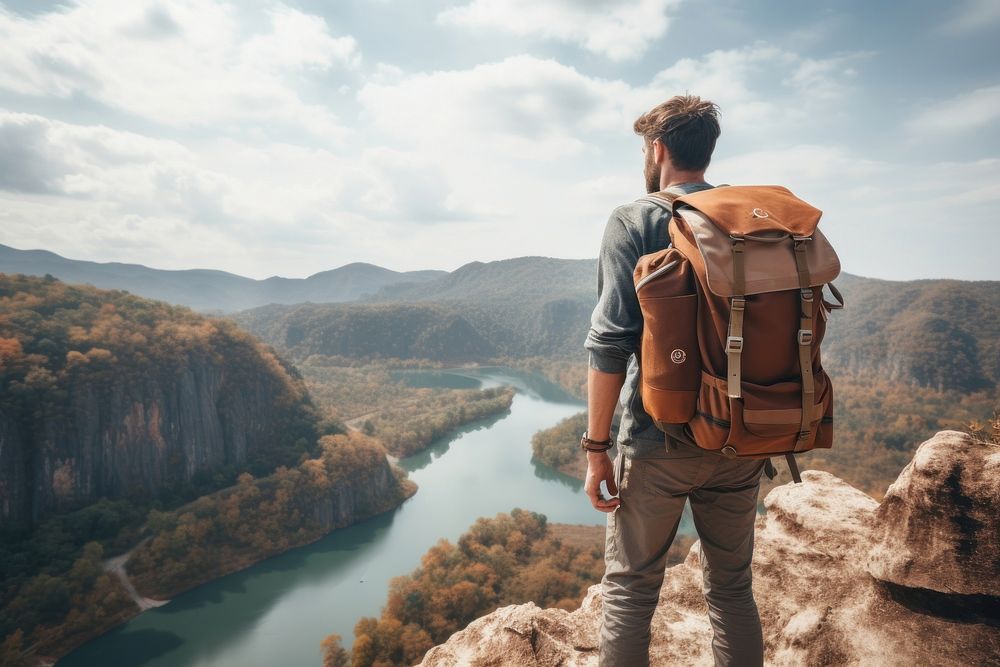 Backpacker man standing at cliff nature backpacking adventure. AI generated Image by rawpixel.