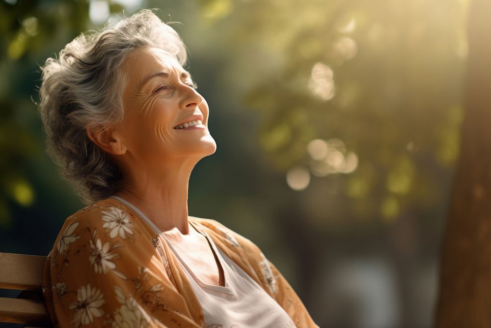 Happy senior woman relaxing laughing outdoors smile. AI generated Image by rawpixel.