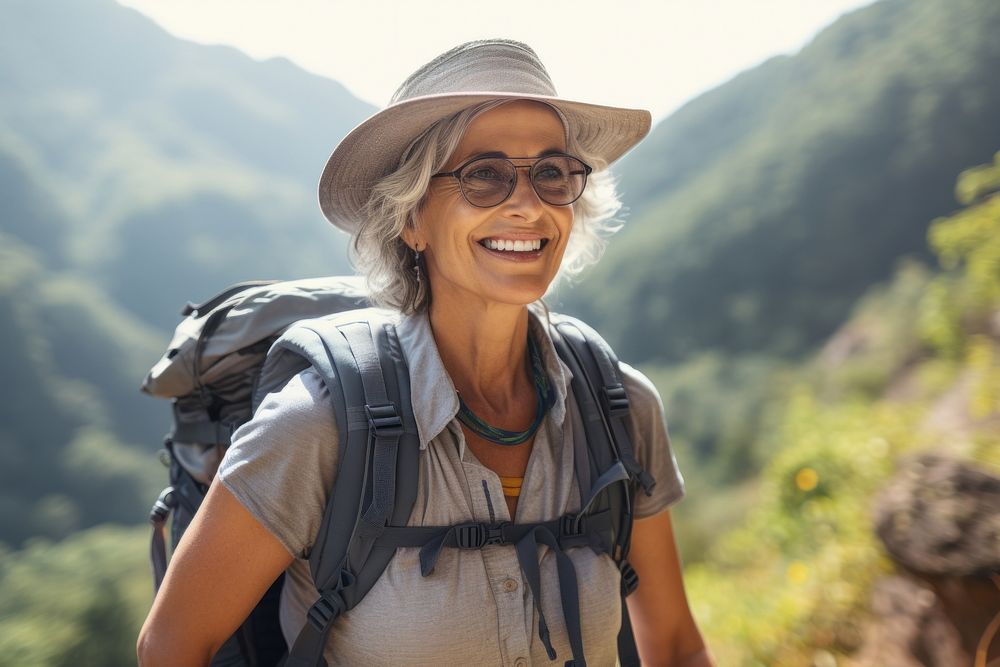 Mature woman on adventure trail in mountain recreation backpack outdoors. AI generated Image by rawpixel.