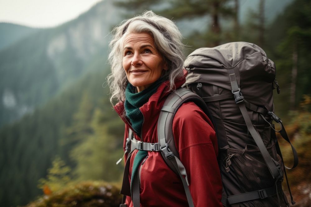 Mature woman on adventure trail in mountain backpacking adult exploration. AI generated Image by rawpixel.