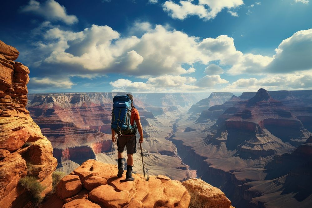 Man climbing grand canyon mountain backpacking adventure outdoors. AI generated Image by rawpixel.