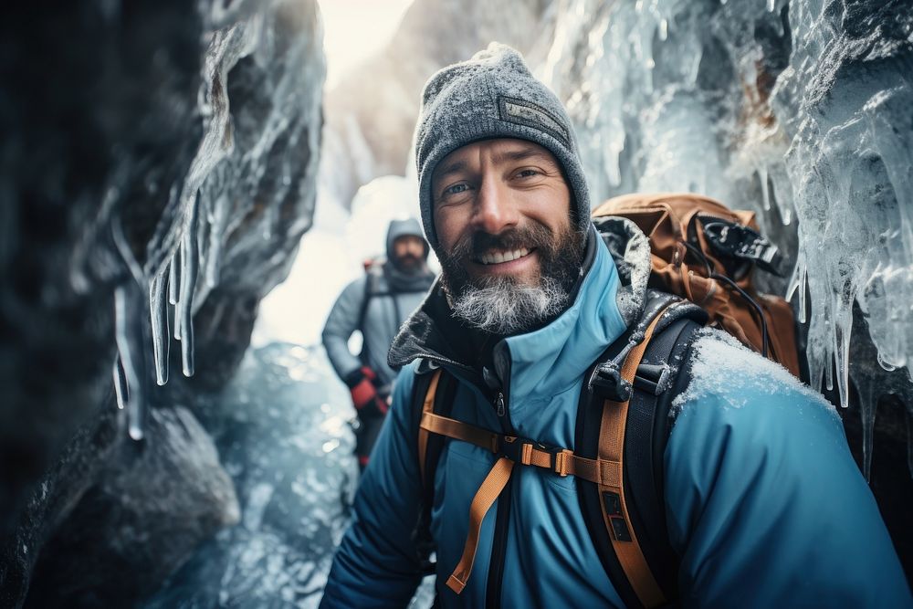 Warm-heart adult man on adventure trail in ice outdoors nature photo. AI generated Image by rawpixel.