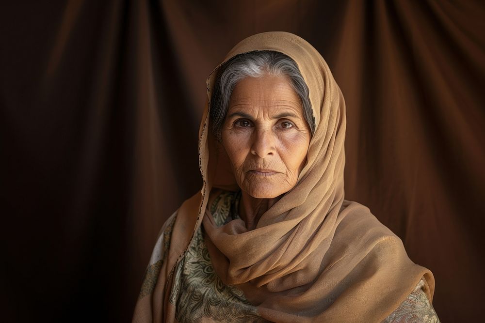 Pakistani senior woman portrait photo contemplation. AI generated Image by rawpixel.
