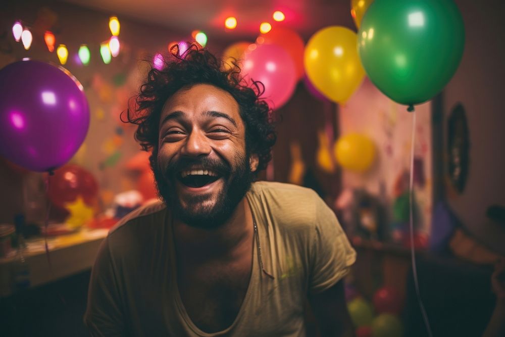 Indian man having fun at the minimal party laughing balloon adult. AI generated Image by rawpixel.