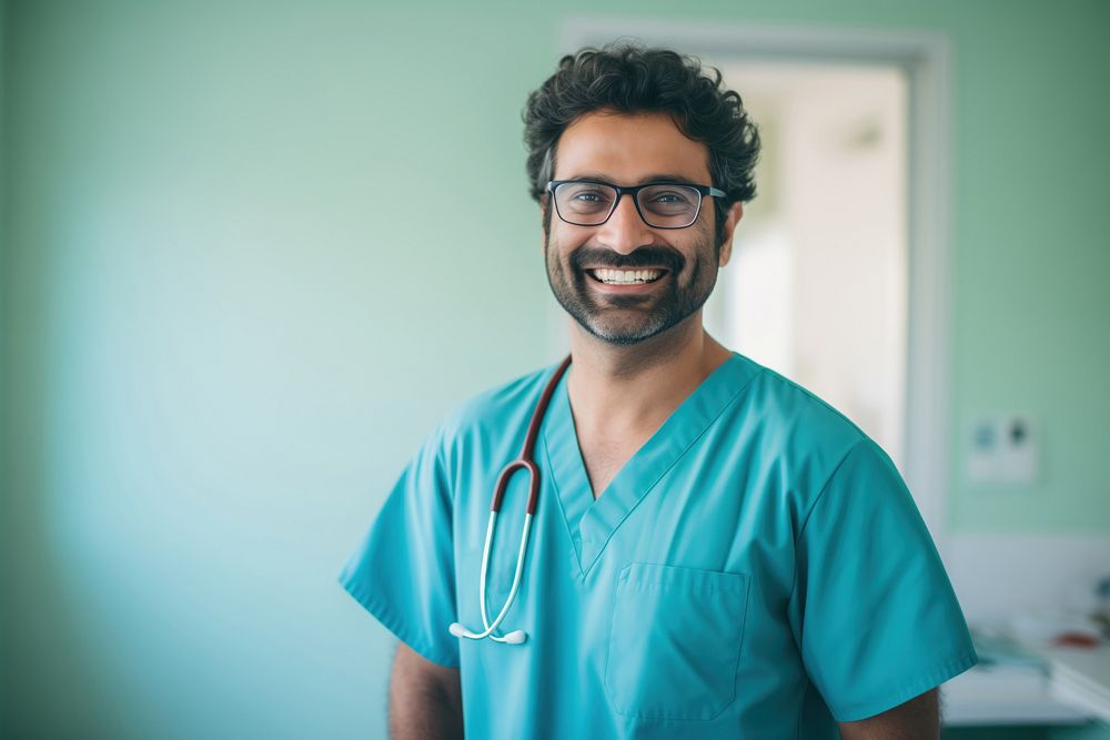 A happy 27 yo doctor from india working in the hospital glasses adult nurse. AI generated Image by rawpixel.