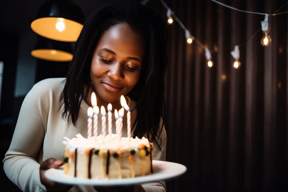 Black South African people candle party cake. AI generated Image by rawpixel.