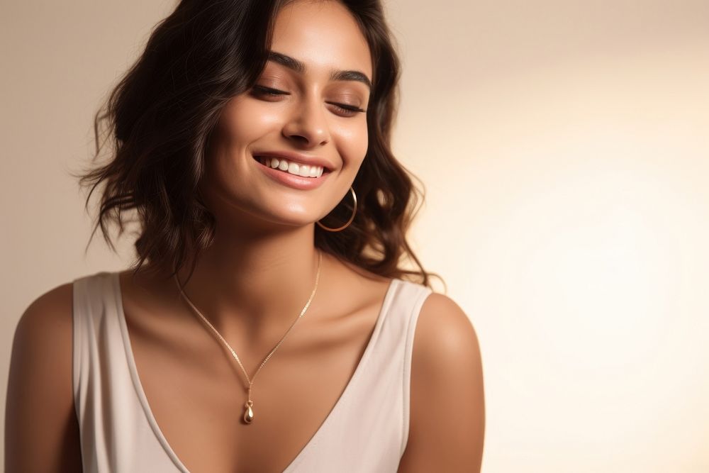 Happy latina woman wearing jewelry laughing necklace smile. AI generated Image by rawpixel.