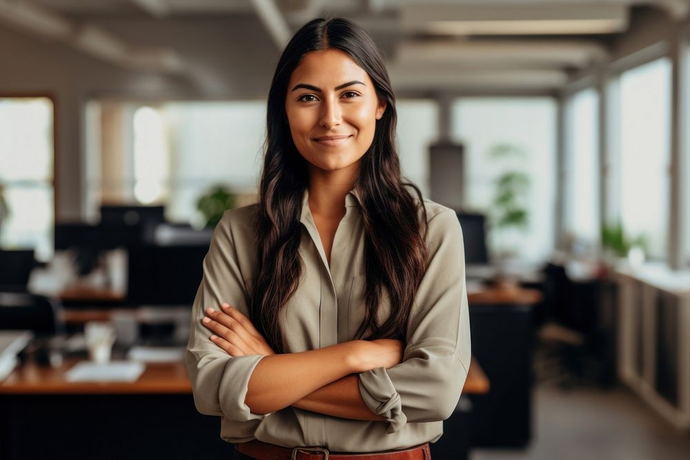 Native american business woman crossing arms smiling office smile. AI generated Image by rawpixel.