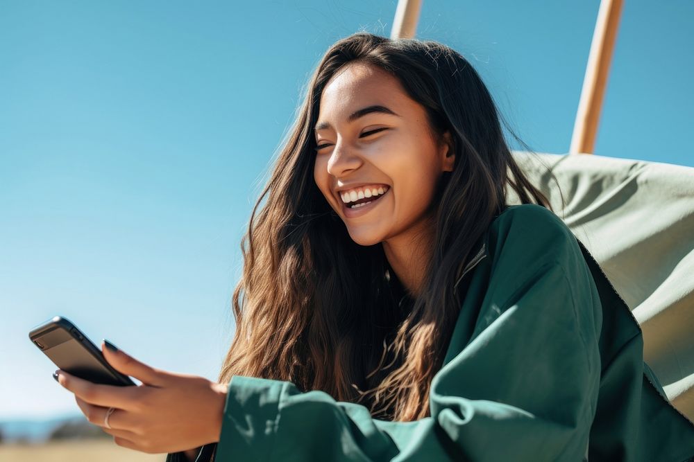 Native american indian woman facetime laughing smile happy. AI generated Image by rawpixel.