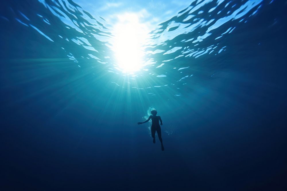 Young woman swimming underwater adventure outdoors. AI generated Image by rawpixel.