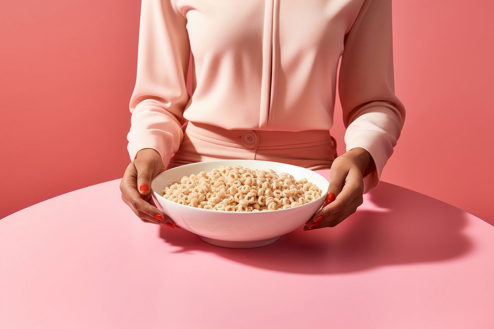 Person is eating a bowl of cereal and milk adult food pink. AI generated Image by rawpixel.