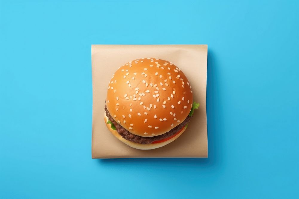 Burger bun sesame food blue background. AI generated Image by rawpixel.