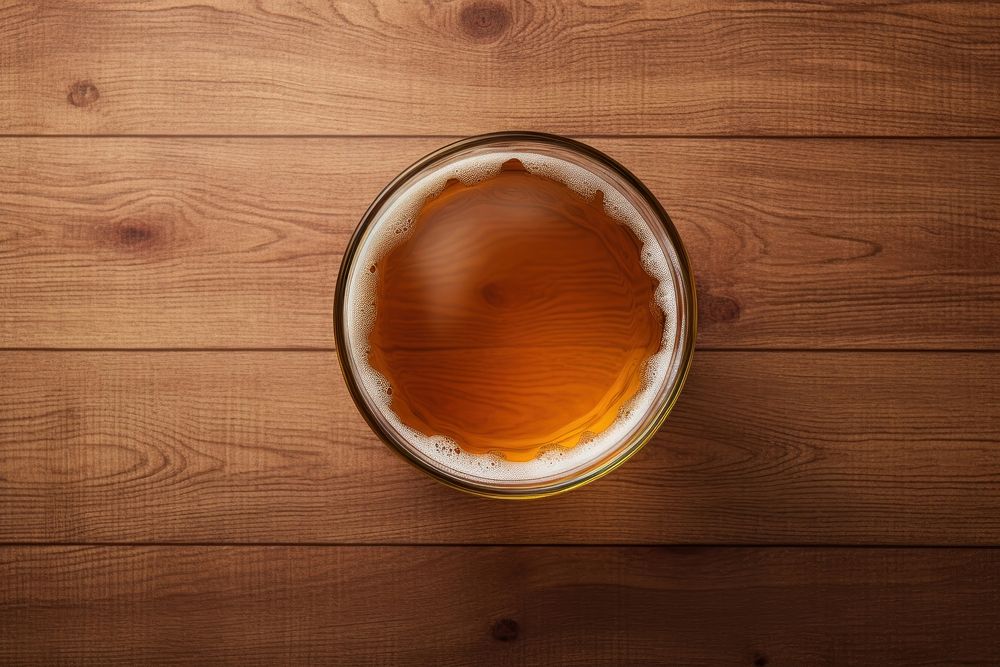 Beer glass drink brown wood. AI generated Image by rawpixel.