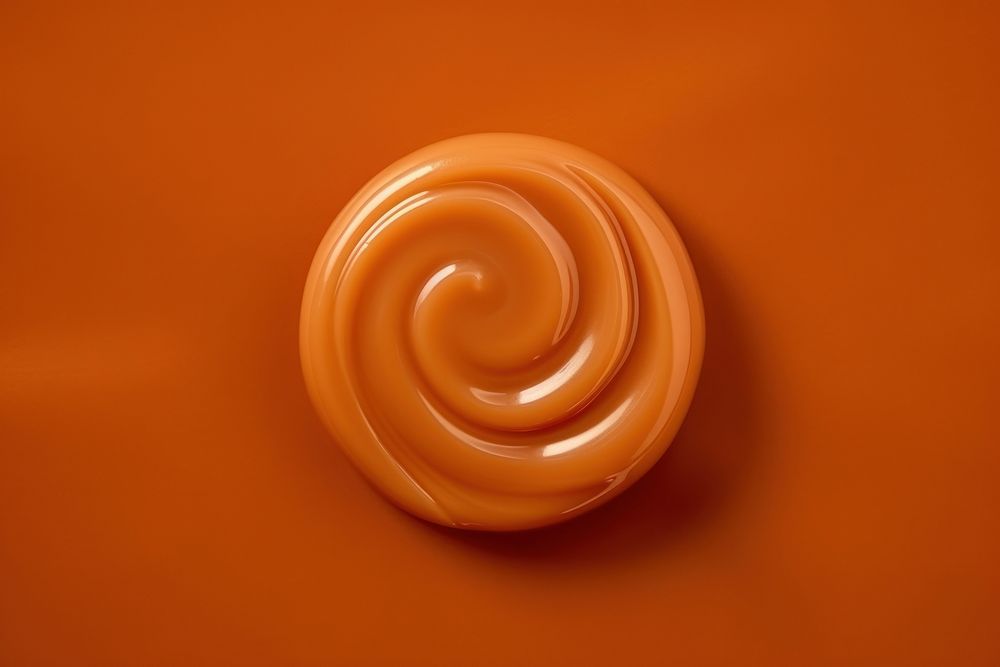 Caramel candy spiral brown food. AI generated Image by rawpixel.