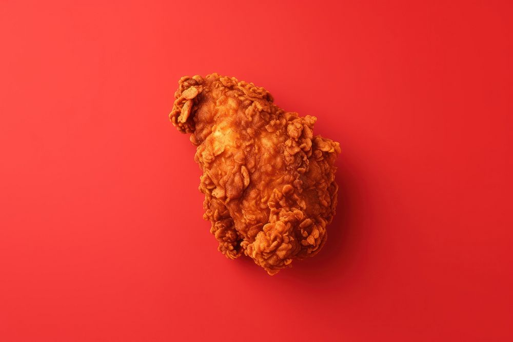 Crispy fried chicken food red red background. AI generated Image by rawpixel.