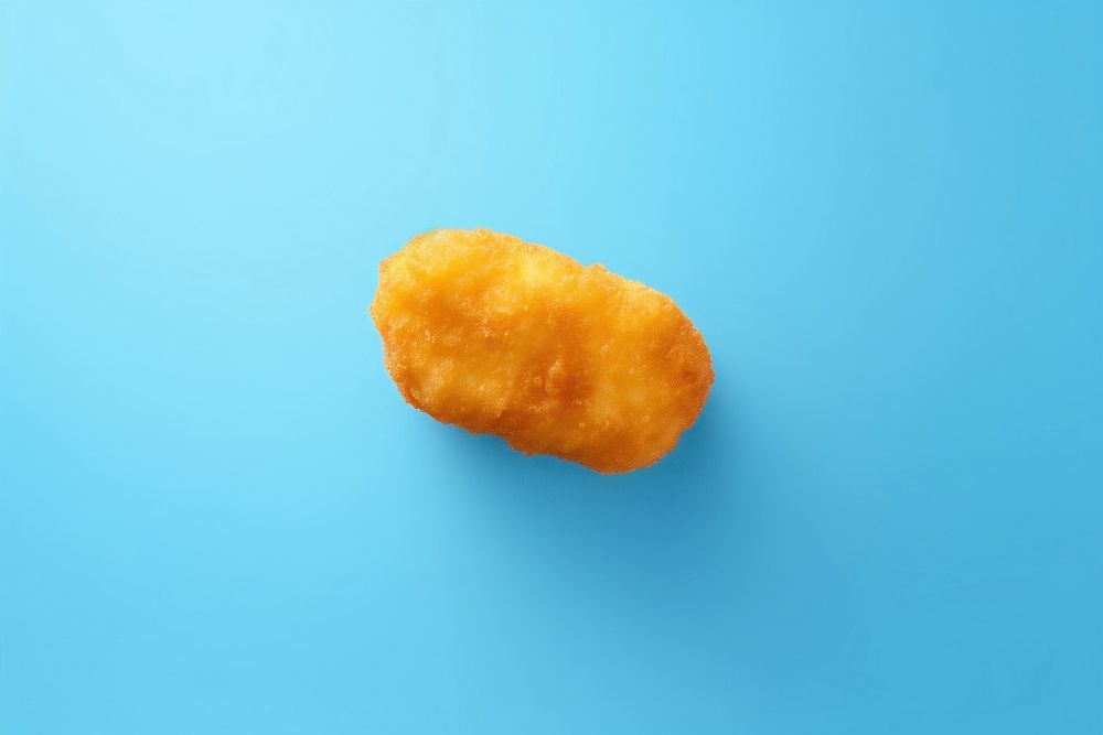 Nugget blue food blue background. AI generated Image by rawpixel.