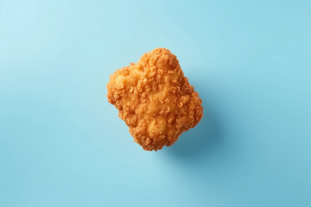 Nugget food blue blue background. AI generated Image by rawpixel.