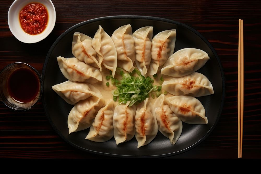 Gyoza chopsticks dumpling plate. AI generated Image by rawpixel.