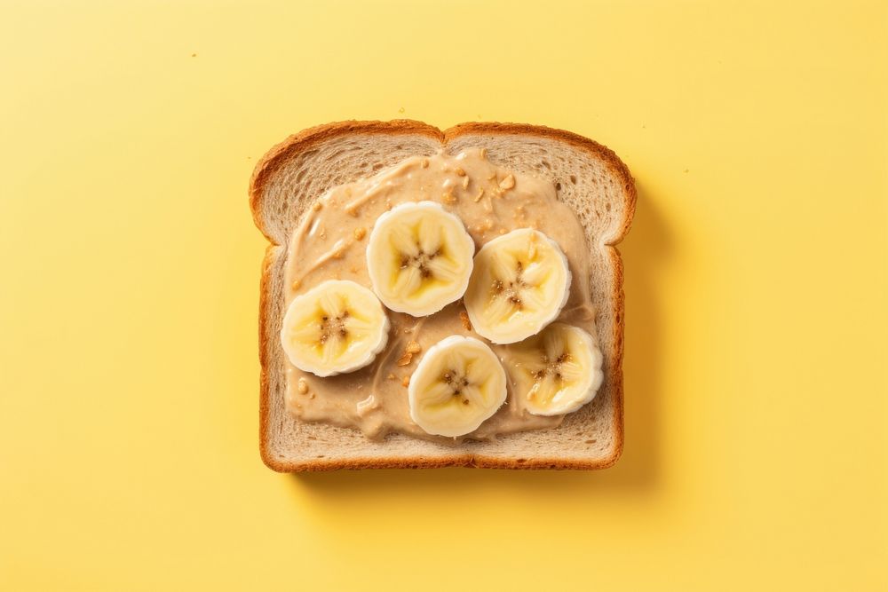 Toast with peanut butter and slice of bananas on top bread food breakfast. AI generated Image by rawpixel.