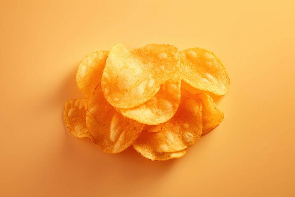 Potato chip food orange background freshness. AI generated Image by rawpixel.