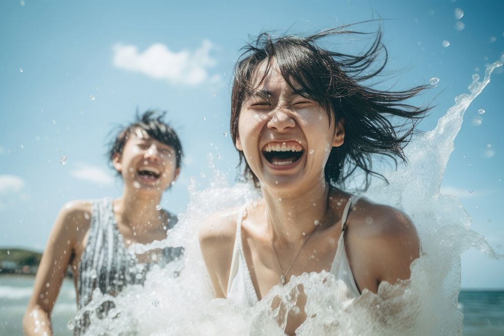 Asian friends splashing laughing portrait. AI generated Image by rawpixel.