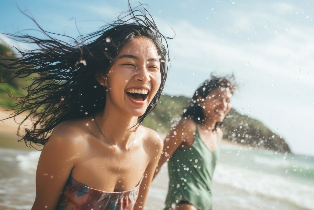 Asian teenage friends splashing laughing summer. AI generated Image by rawpixel.