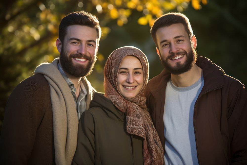 3 people in a Muslim family laughing smiling adult. AI generated Image by rawpixel.