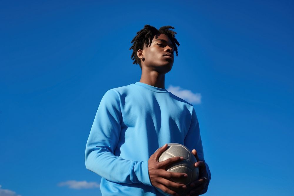 Black young man with basketball football sports blue. AI generated Image by rawpixel.