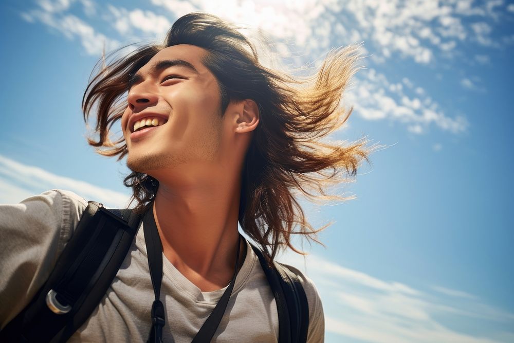 Smiling asian young man laughing smiling sunny. AI generated Image by rawpixel.