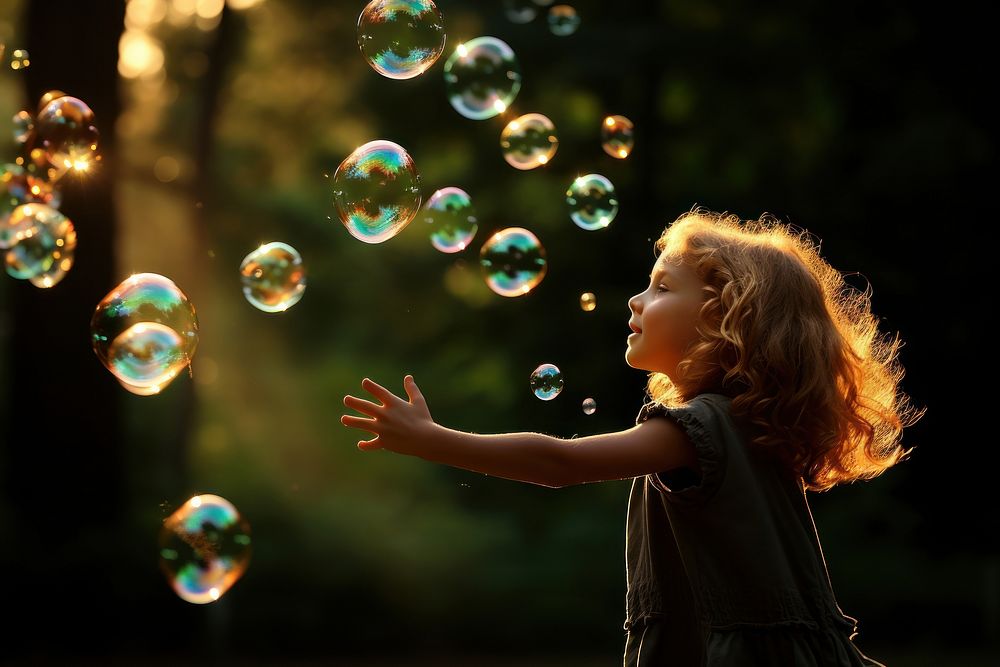 Floating bubbles portrait outdoors child. AI generated Image by rawpixel.