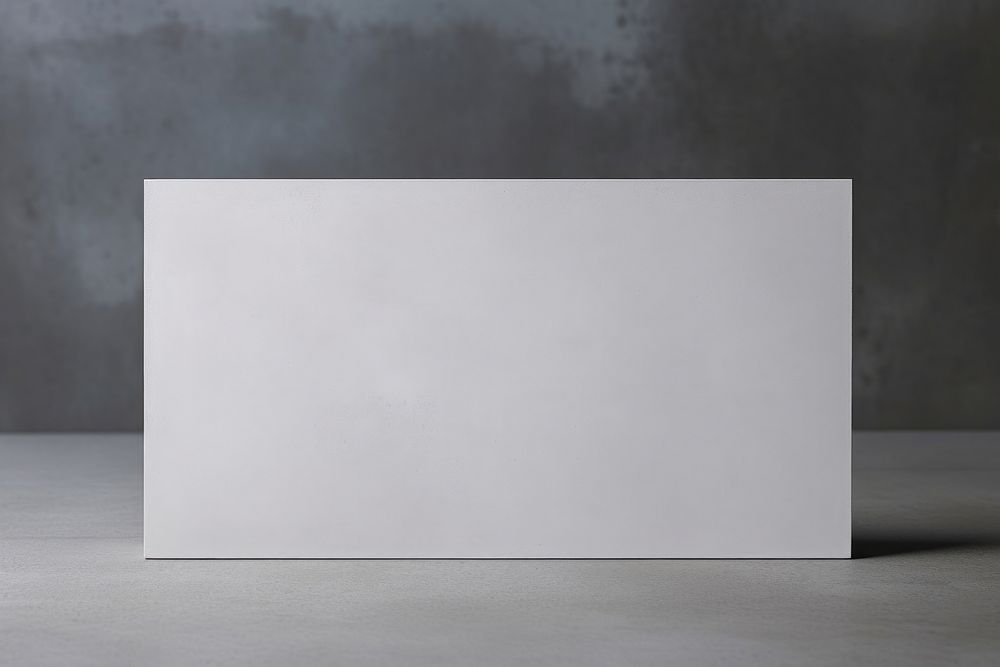 A blank white business card paper gray wall. AI generated Image by rawpixel.