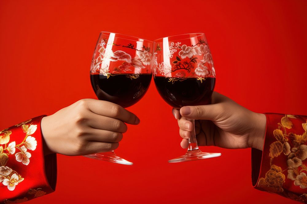 2 hands in Chinese outfit toasting celebration drink glass. AI generated Image by rawpixel.